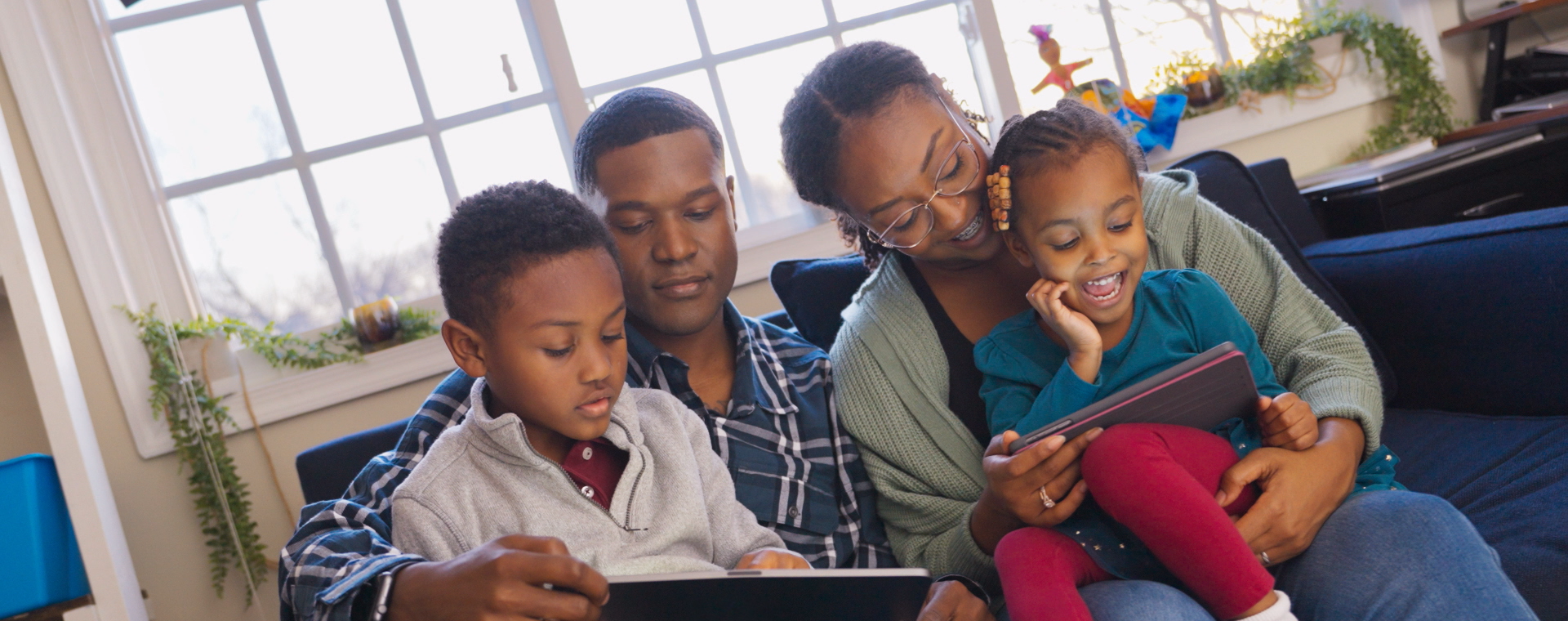 A family looking at a tablet together
